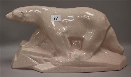 A pink glazed crackleware Deco polar bear height 21cm width 39cm